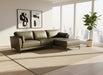 Gray sectional sofa on a wooden floor with a white backdrop