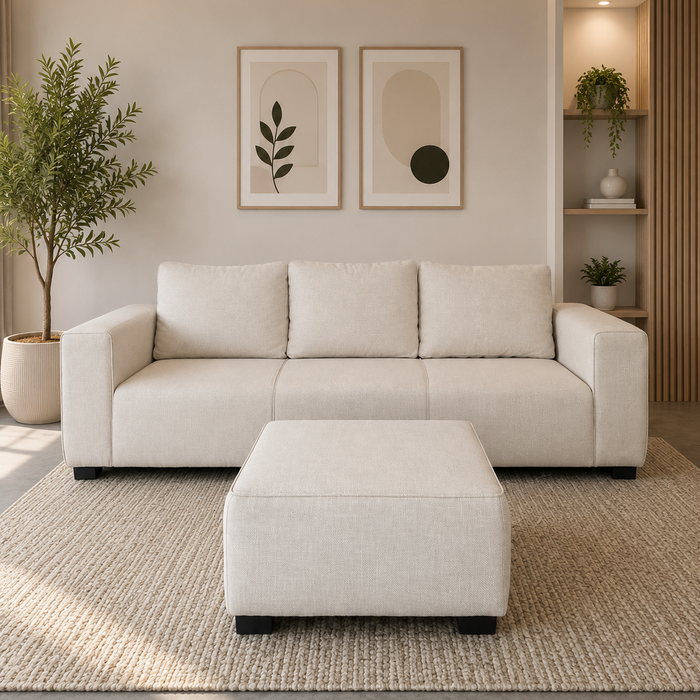 Modern living room with a beige sectional sofa, ottoman, and decorative elements.