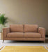 Couch in a matt mustard fabric