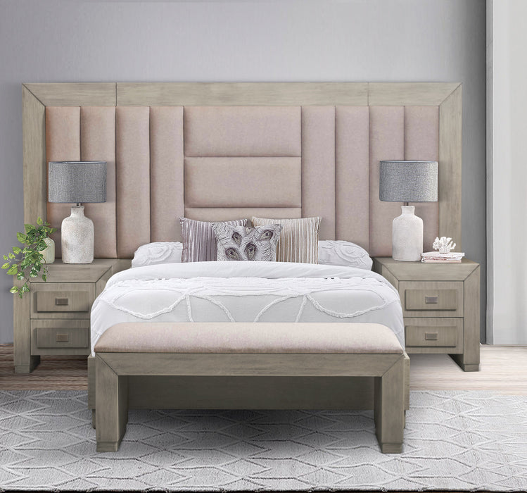Neatly arranged bedroom with a bed, vanity, and nightstands.