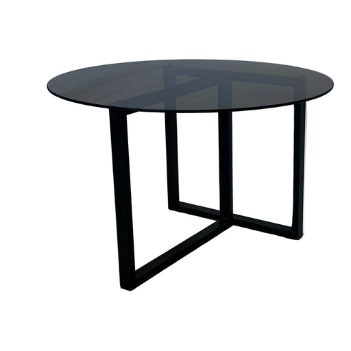 Black metal wall-mounted shelf against a textured white wall
