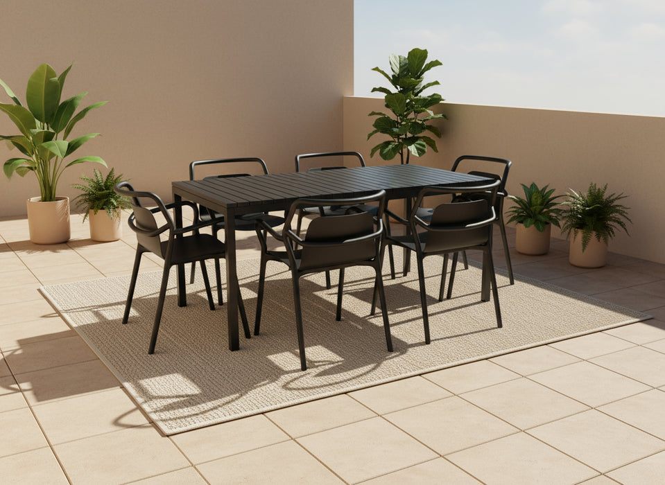Black outdoor table and chairs on a white backdrop
