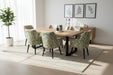 Wooden dining table with eight patterned chairs on a carpeted floor.