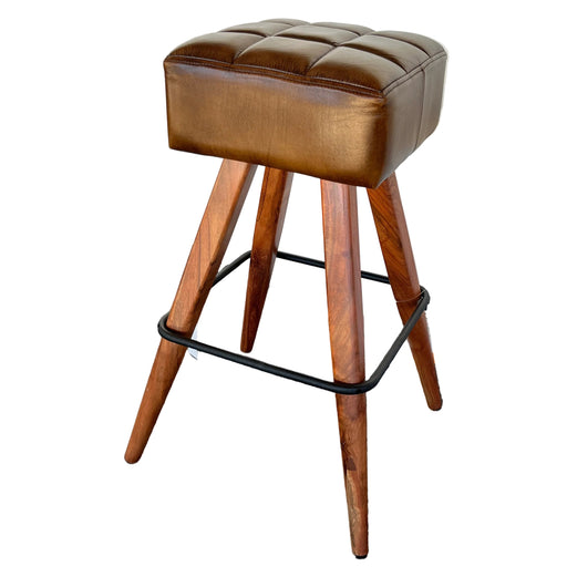 Wooden stool with brown cushioned seat on a staircase