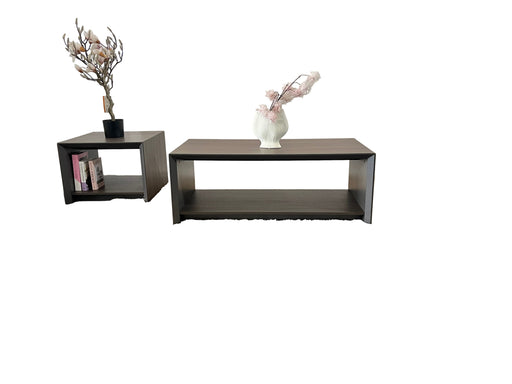 Two dark wooden tables with decorative items on a gray carpeted floor.