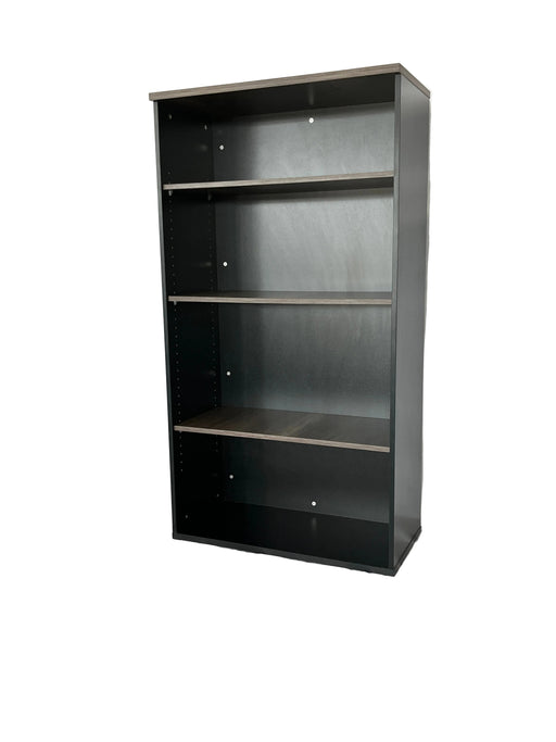 Black rectangular object on a white draped surface