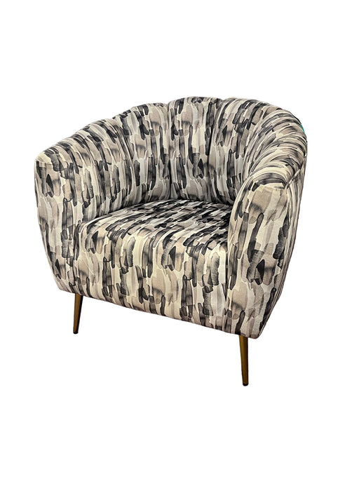 Patterned chair against a brown wall with a Bosch refrigerator in the background