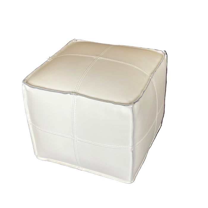 White cube-shaped object on a textured brown surface