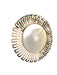Decorative round mirror with gold frame on a gray wall