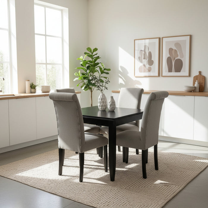 Gray chair with black legs on a white surface and purple floor.