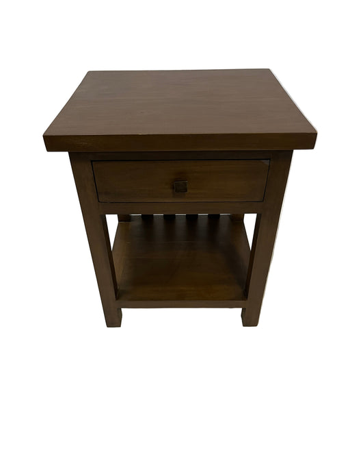 Wooden wall-mounted shelf on a textured white background