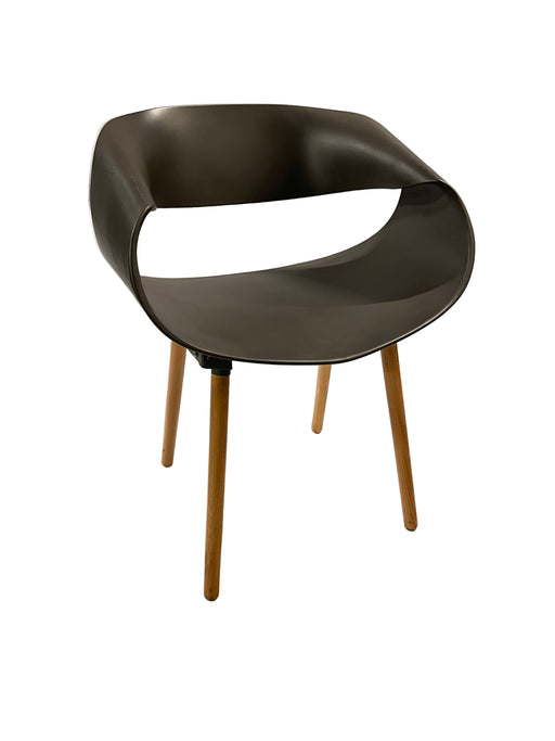 Modern black stool with wooden legs on a white background