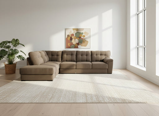 Brown sectional sofa in a room with a white sheet covering furniture.