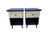 Two nightstands with a wooden finish and black accents on a gray floor.