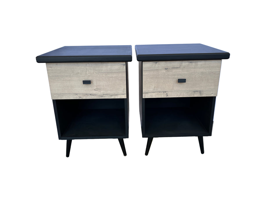 Two nightstands with a wooden finish and black accents on a gray floor.