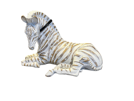 Decorative zebra figurine on a brown leather couch