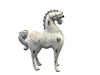 Decorative horse figurine with intricate designs on a textured white background