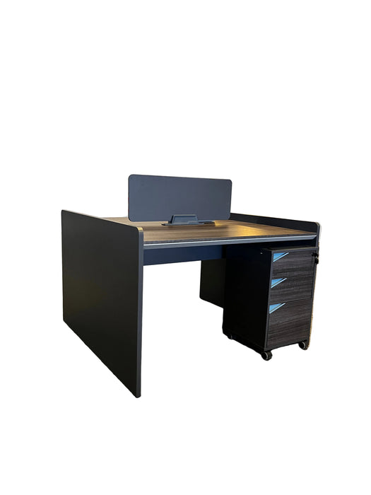 Modern office desk with a computer monitor in an open-plan office setting.