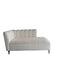 Modern white sofa against a dark wall with a glass staircase in the background