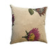 Decorative pillow with floral design on a textured surface