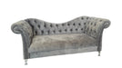 Gray velvet sofa with tufted backrest on a white background