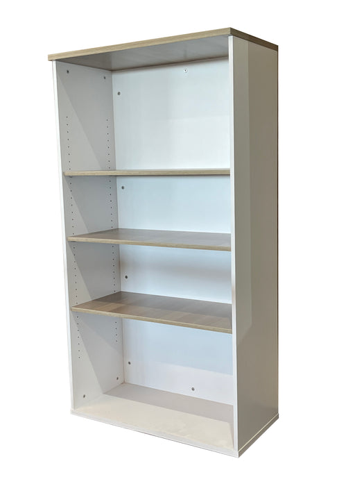 Tall bookshelf with four shelves on a white background
