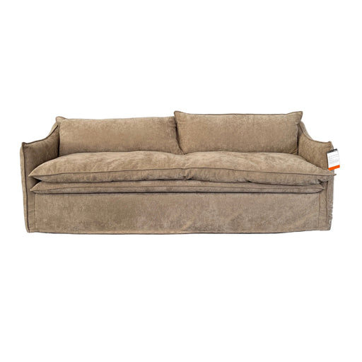 A beige upholstered bench or ottoman with a rectangular shape, shown from a top-down angle on a white floor covering next to a dark gray floor.