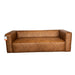A brown upholstered bench or low sofa shown indoors on a white drape, with a carpeted floor and store-like surroundings visible.