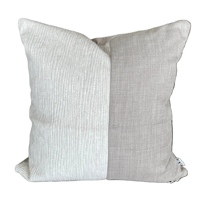 Gray textured pillow on a brown sofa