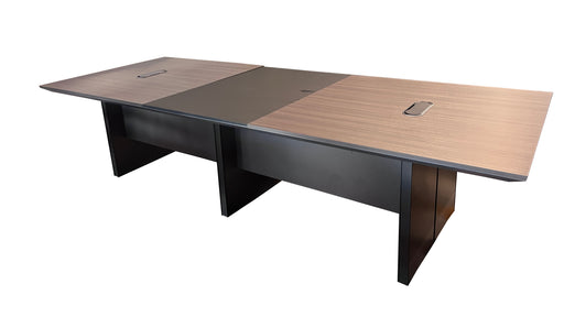 Large conference table with a wooden surface and black base on a white background