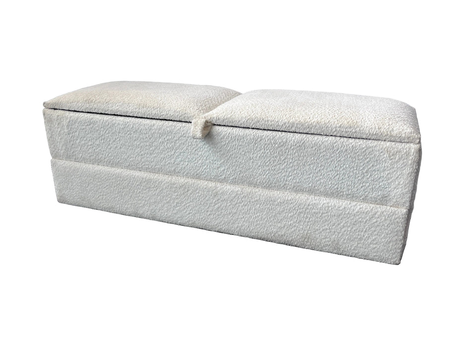 White textured ottoman with a lid on a gray floor against a white wall.