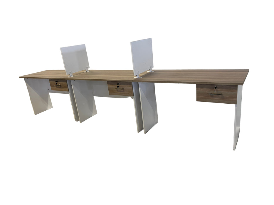 Wooden desk with a clear partition on a white draped background