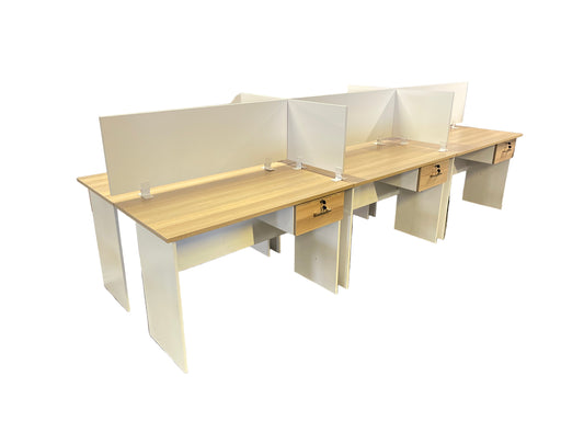 Two office desks with partition walls in an indoor setting
