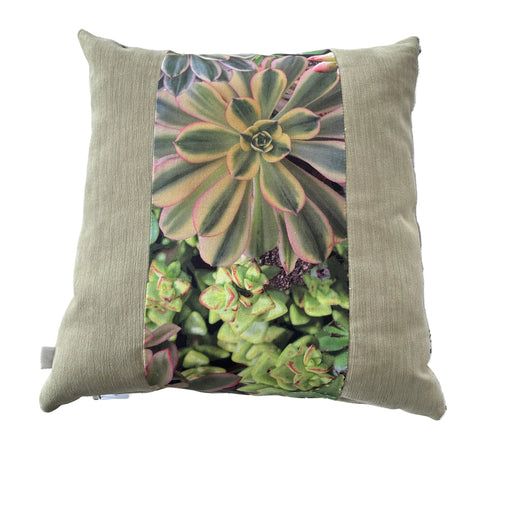 Decorative pillow with succulent pattern on a textured surface
