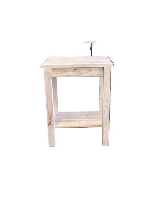 Wooden stool against a purple wall with a person partially visible in the background.