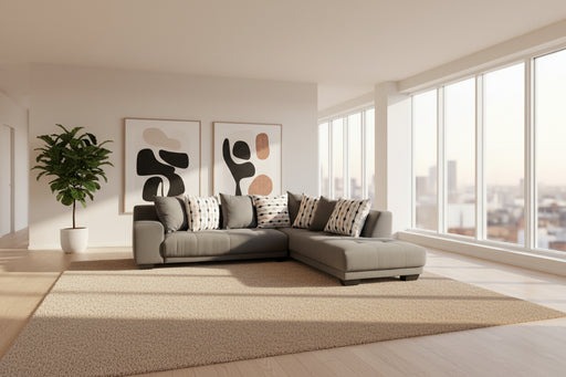 Gray sectional sofa with patterned cushions on a gray carpet
