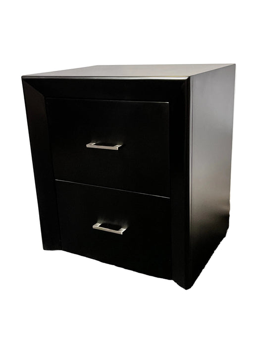 Black nightstand with two drawers on a textured surface