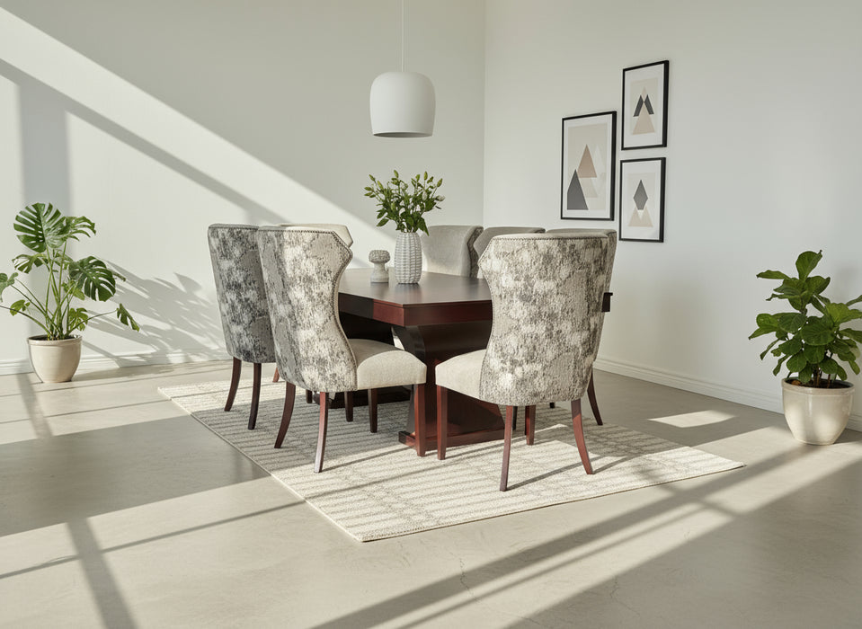 Dining table set with patterned chairs against a white backdrop