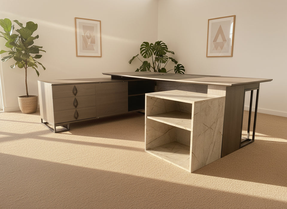 Modern office desk with storage drawers and shelves on a gray carpeted floor.