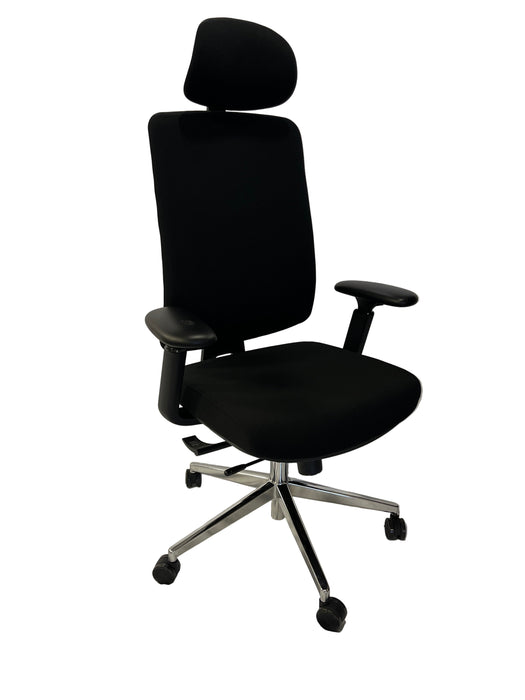 Black office chair on a white draped background