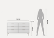 Furniture dimensions with a silhouette of a person for scale on a white background