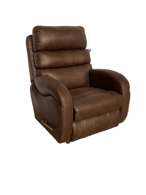 Brown leather recliner chair on a white surface with a beige background